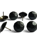 Sixty Piece Bundle Of Hella Sturdy Matte Black Upholstery Tacks featuring a slick one inch round head for easy installation.
