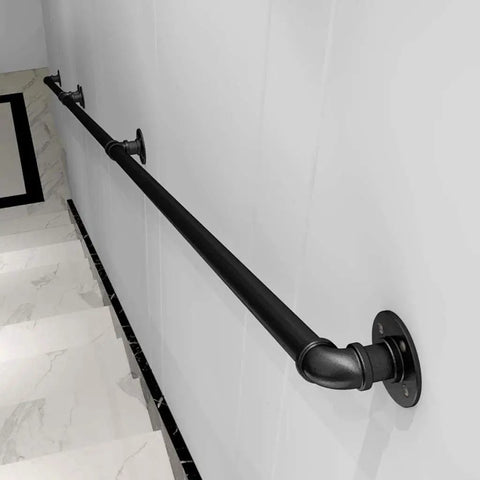 Straight Up Rock Solid Black Iron Railing For Indoor And Outdoor Use Adjustable Height Safety Guardrail With Rustproof Finish For Decks Patios And Staircase Installation mounted on a wall.