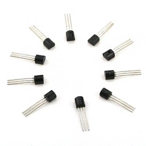Top view of multiple black and silver transistors arranged in a circle from the 675 Piece Power Transistor Kit Assortment With 15 Models