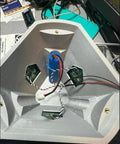 Heavy Duty Solar Hanging Enclosure For LoRa Nodes with battery compartment and circuitry arrangement, rugged grey plastic design.