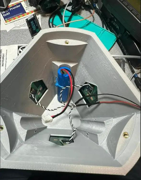 Heavy Duty Solar Hanging Enclosure For LoRa Nodes with battery compartment and circuitry arrangement, rugged grey plastic design.