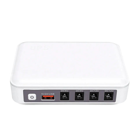 Portable Mini Ups Boasting Hella Reliable 6000Mah Backup Power For Seamless Router Modem And Security Camera Operation Keeping Your Entire Home Network Running Smooth As Butter When The Grid Drops, white compact device with four output ports.