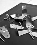 Heavy Duty Metal Blinds Hold Down Brackets Silver Door Bottom Clip Kit With Screws on black surface, showing multiple metal clips.
