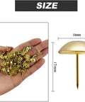 Tough As Nails Gold Metal Upholstery Tacks For Furniture Fixes And Slick Diy Upgrades 500 Pack heavy duty brass thumb nails in a hand with size dimensions.