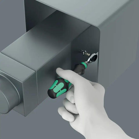 Hand using Zyklop Mini 4 Bit Ratchet One Quarter Inch Drive Fifty Millimeter Hex Bit Holder for precise fastening in tight space