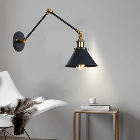Badass Industrial Swing Arm Wall Sconce Adjustable Metal Light Fixture E27 Socket mounted on a wall above a small table.