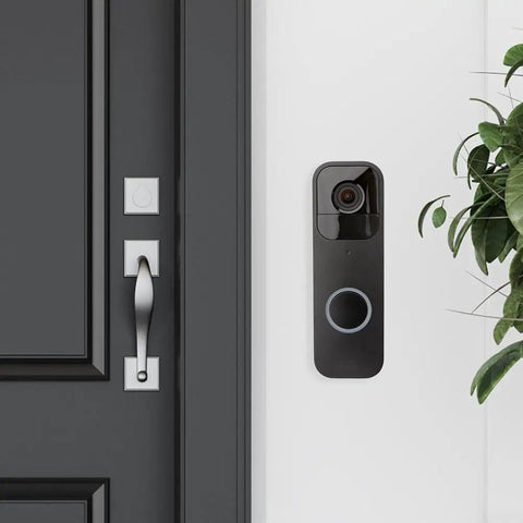 Black Doorbell Back Plate Replacement For Video Doorbell Mounting Systems Kit installed on a white wall by a door.