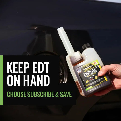 Top Shelf Diesel Fuel Additive And Daily Tune Up Formula Keeps Your Rig Running Slick Boosts Mileage And Sweeps Away Carbon Gunk For A Rock Solid Highway Cruise In A 16 Oz Bottle held near a vehicle fuel tank.