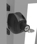 Close-up of Two Sided Gate Latch With External Button And Key Lock for square post fence gates, black finish, installed on a gate.