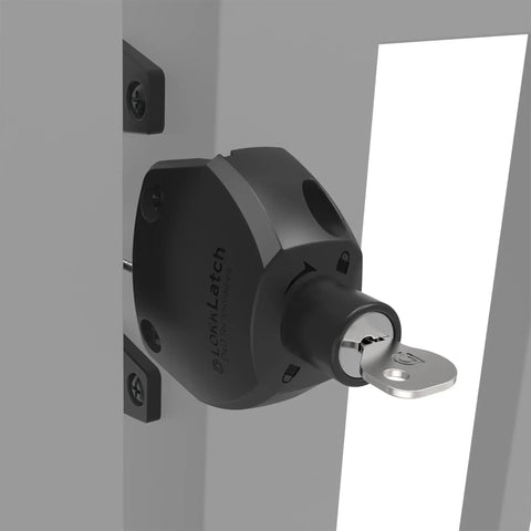 Close-up of Two Sided Gate Latch With External Button And Key Lock for square post fence gates, black finish, installed on a gate.