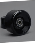 Black PU quad skate wheels with bearings, visible glossy finish, emphasizing high elasticity and easy installation.