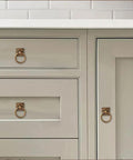 10 Pack 1.9 Inch Ring Cabinet Knobs With Vintage Antique Brass Backplates For Drawers Dressers Kitchen Cabinets Closets Wardrobes DIY Friendly Heavy Duty Zinc Alloy Hardware installed on light gray cabinet doors and drawers.