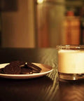 Lab Beaker Rocks Glasses Set Of 2 For Cocktails And Science Themed Barware with milk next to cookies on a dark table.
