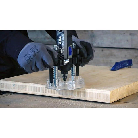 Dremel 335-01 plunge router attachment for rotary tool with clear base plate on wood