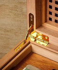 Antique 31x30mm 90 Degree Spring Hinge Set installed in wooden box corner, showcasing sturdy gold finish for furniture cabinets and jewelry boxes.