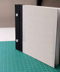 Twenty Pack 55mm Silver Aluminum Chicago Screw Posts Heavy Duty Binding Fasteners For Scrapbooks Photo Albums Leather Belts Menu Covers And Diy Crafts With Kickass Durability And Slick Polish Finish used in a grey scrapbook.