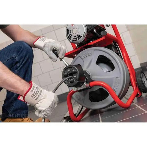 Using Heavy Duty 115 Volt Electric Conduit Bender Machine Featuring Autofeed and C45 Integral Wound Cable to bend rigid pipe.