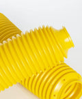 Hella Heavy Duty Yellow Fork Bellows Rubber Suspension Boot in close-up, showcasing ribbed design for offroad protection.