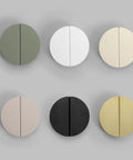 Assorted colored round cabinet knobs in various finishes, displayed on a gray background. Orange Two And A Half Inch Drawer Pulls Four Piece Set Half Moon Cabinet Handles Semicircle Knobs With Screws For Kitchen Cabinets Cupboards Bedroom Furniture Doors Durable Aluminum Alloy not visible.