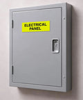 Close-up of a red electrical panel sign for fire regulation safety compliance installed on a gray panel indoors.