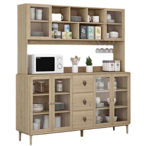 Wooden kitchen hutch with open shelving and cabinets, microwave on countertop, assorted mugs and plates displayed.