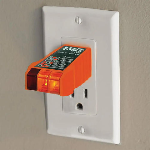 Outlet tester plugged into wall socket, part of Non Contact Voltage Tester With Outlet Tester Dual Range 12 To 48V AC And 48 To 1000V AC