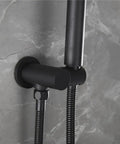 Wall-mounted matte black bathtub faucet with handheld shower sprayer, showcasing stainless steel hose connection and brass body