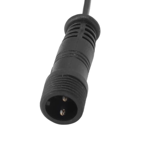 Close-up of the waterproof male connector from the Heavy Duty 3.3 Foot Deck Light Extension Cable With Sturdy Two Pin IP67 Waterproof Male Female Connector Engineered For No Fuss Patio Wiring And Backyard Party Glow Ups.