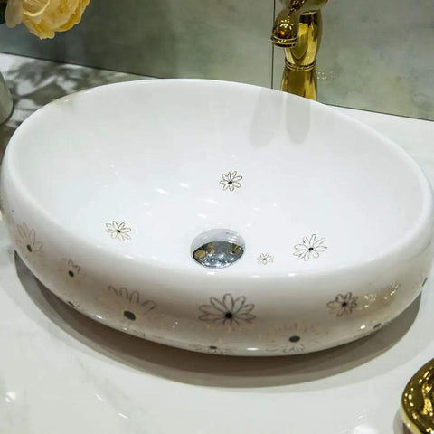 Slick Ceramic Oval Vessel Sink For Modern Bathroom Counters Smooth Glazed Finish with floral design and 12-liter capacity.