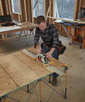 BORA NGX 100-inch aluminum clamp-edge saw guide rail used with a circular saw on a plywood workbench.