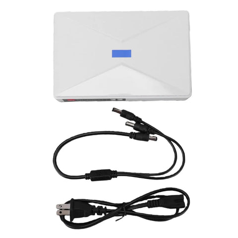 Kickass Mini Ups With 10400mAh Battery Backup And Us Plug For Router Modem shows white battery backup unit with cables.