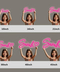 Pink LED Neon Sign For Wall Handmade Decor With Dimmer Room Glow Neon Light For Bedroom Inspirational Light Sign To Boost Vibes Easy Mount Perfect Birthday Party Gift shown in various sizes held by a girl.
