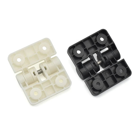Two XK551 resin positioning hinge blocks, white and black plastic door hardware components