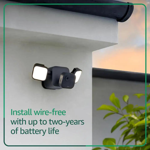 Outdoor 4 Floodlight Camera with Wireless Security 700 Lumen Smart Lighting mounted on wall with two year battery life