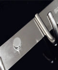 Close-up of heavy duty stainless steel wall mount hook showing attachment point for the heavy duty stainless steel wall mount hooks low profile hidden storage setup hella durable rust resistant key and coat rack three pack for bathroom organization.