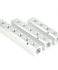 Three aluminum two-way pneumatic manifold blocks with multiple threaded ports, G1/2 inlet and G1/4 outlets.