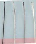 Four metal eyeglass frame temple arms on a pastel background, part of Replacement Metal Eyeglass Frame Temples and Sunglasses Arms Kit.