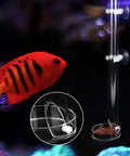 Crisp Acrylic Aquarium Feeder Tray, 9.84 Inch Leak Proof Fish Tank Feeding Tube with suction mount showing fish and pellets.