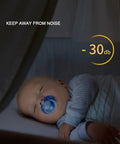 Baby sleeping peacefully in a crib with a pacifier, surrounded by soft light, indicating soundproofing at -30 dB.