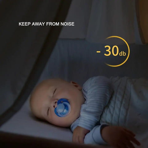 Baby sleeping peacefully in a crib with a pacifier, surrounded by soft light, indicating soundproofing at -30 dB.
