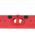 Red plastic woodworking hinge drilling jig base with central bore and two black adjustment dials