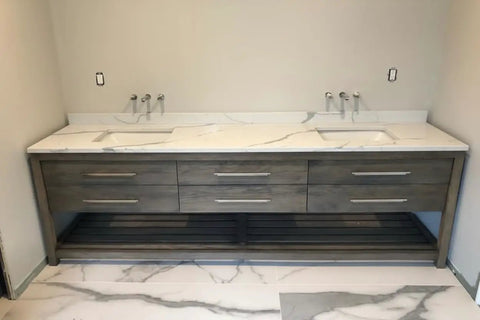 Top Tier Light Oak Reactive Water Based Wood Stain Zero VOC Heavy Duty 55 Gallon Drum on a bathroom vanity with marble top.