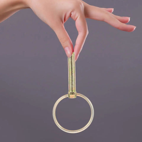 Hand holding heavy duty galvanized lynch pin with ring, zinc plated for trailers and farm equipment