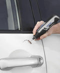 Hand using Totally Wireless Rotary Multi Tool With Super Cushioned Glove Grip and Killer 15 Piece Accessory Kit on car door