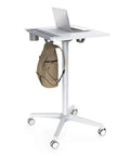 Game Changer Adjustable Lectern Podium Stand With Smooth Wheels For Quick Presentations, white mobile desk with laptop and backpack.