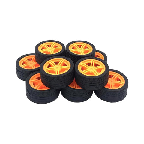 10 Piece Model Car Wheel Set With Rubber Tires And Five Round Shaft Axles in bright yellow, close-up view.