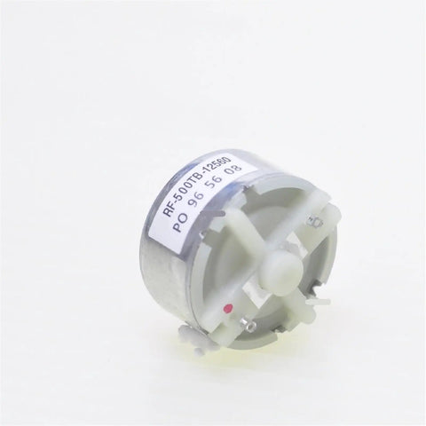 32 mm DC motor with label, ideal for DIY projects and robotics, operates smoothly between 3V and 12V, compact design.