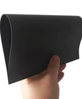 Person holding a non-adhesive magnetic sheet, flexible and 8.5 x 11 inches, showing material texture for crafts and DIY projects.