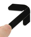 Close-up of black plastic center finder ruler held by hand for locating center of round workpieces on mini lathe/milling.