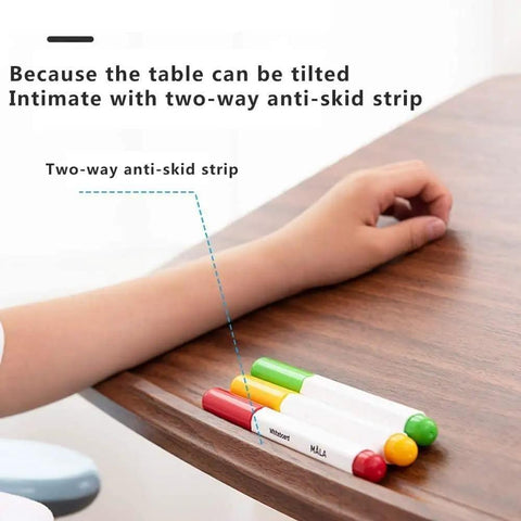 Close-up of rolling sit stand desk's anti-skid strip and colorful markers, showcasing ergonomic features and usability.